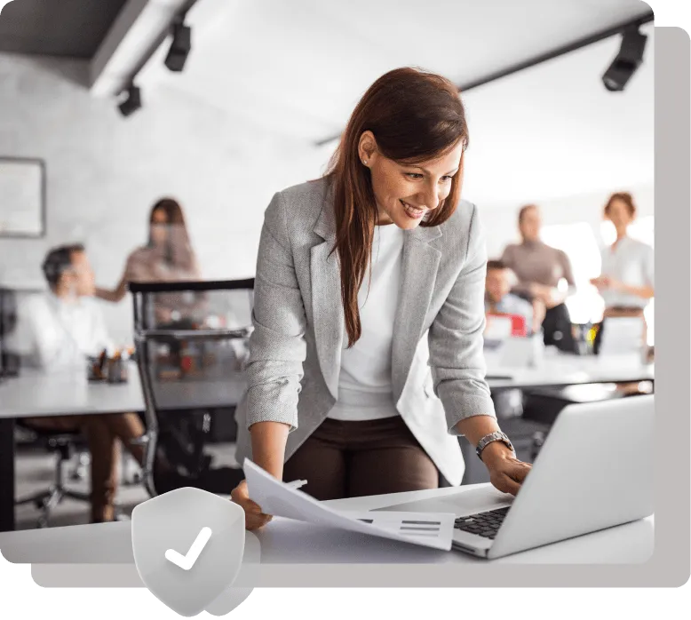 Smiling businesswoman working in a modern office.