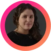 Person with dark curly hair in a circular pink and orange frame, representing LinkGraph's expertise in LLM optimization and brand visibility.