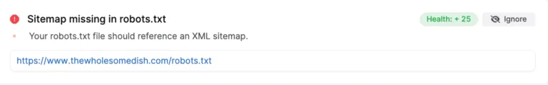 Screenshot showing a notification that sitemap is missing in the robots.txt file for "thewholesomedish.com," advising to reference an XML sitemap and highlighting potential robots.txt issues.
