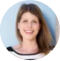 A woman smiling in front of a blue background, perfect for a landing page or ebook cover.