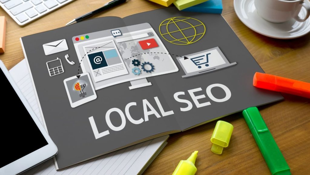 Open book with graphic of monitor and the words local seo