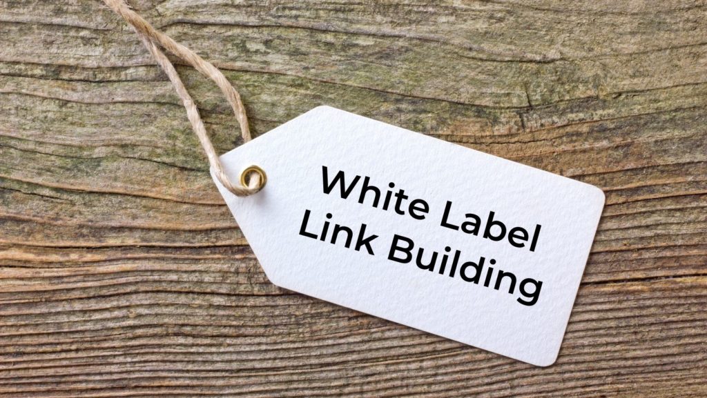 white label link building on a white label sitting on wood