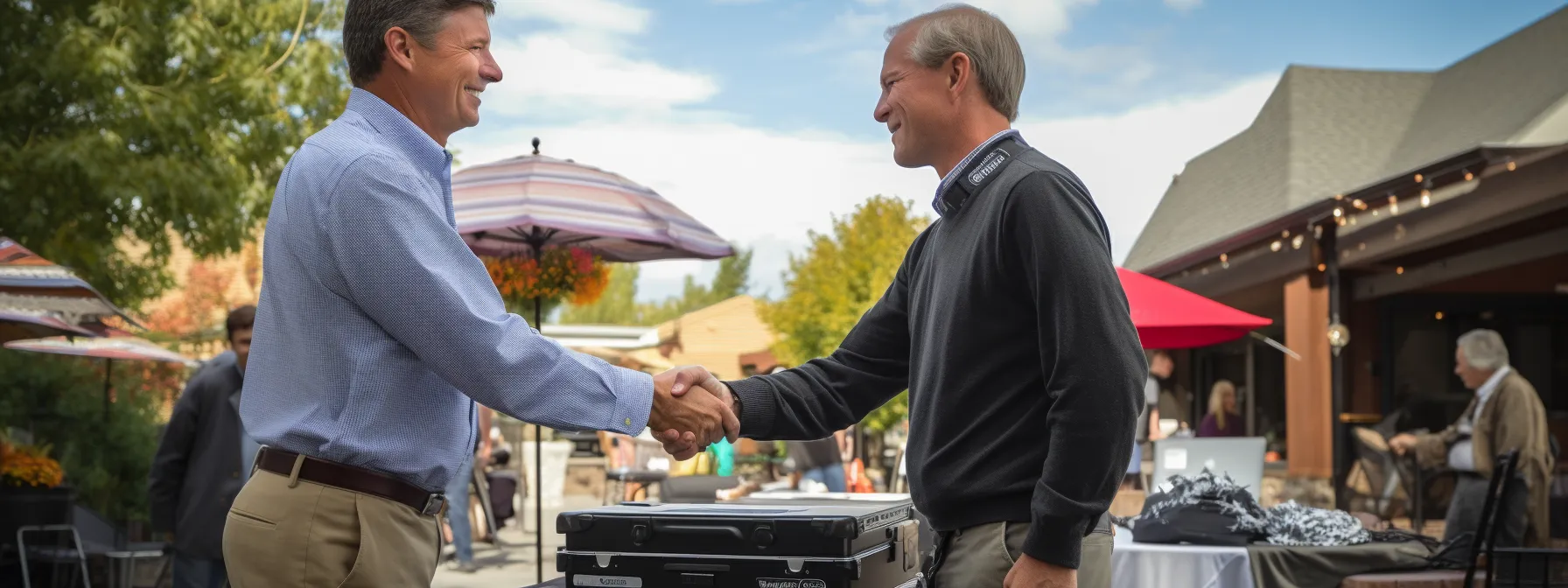 a radio station representative shaking hands with a local business owner at a community event.