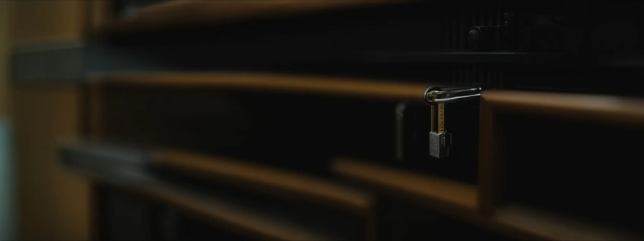 a padlock secured on a server rack.