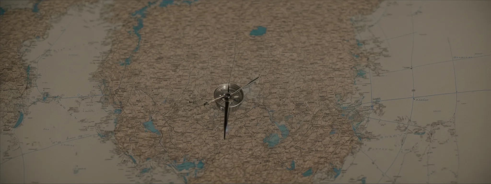 a compass on a map signifying strategic navigation through a complex terrain.