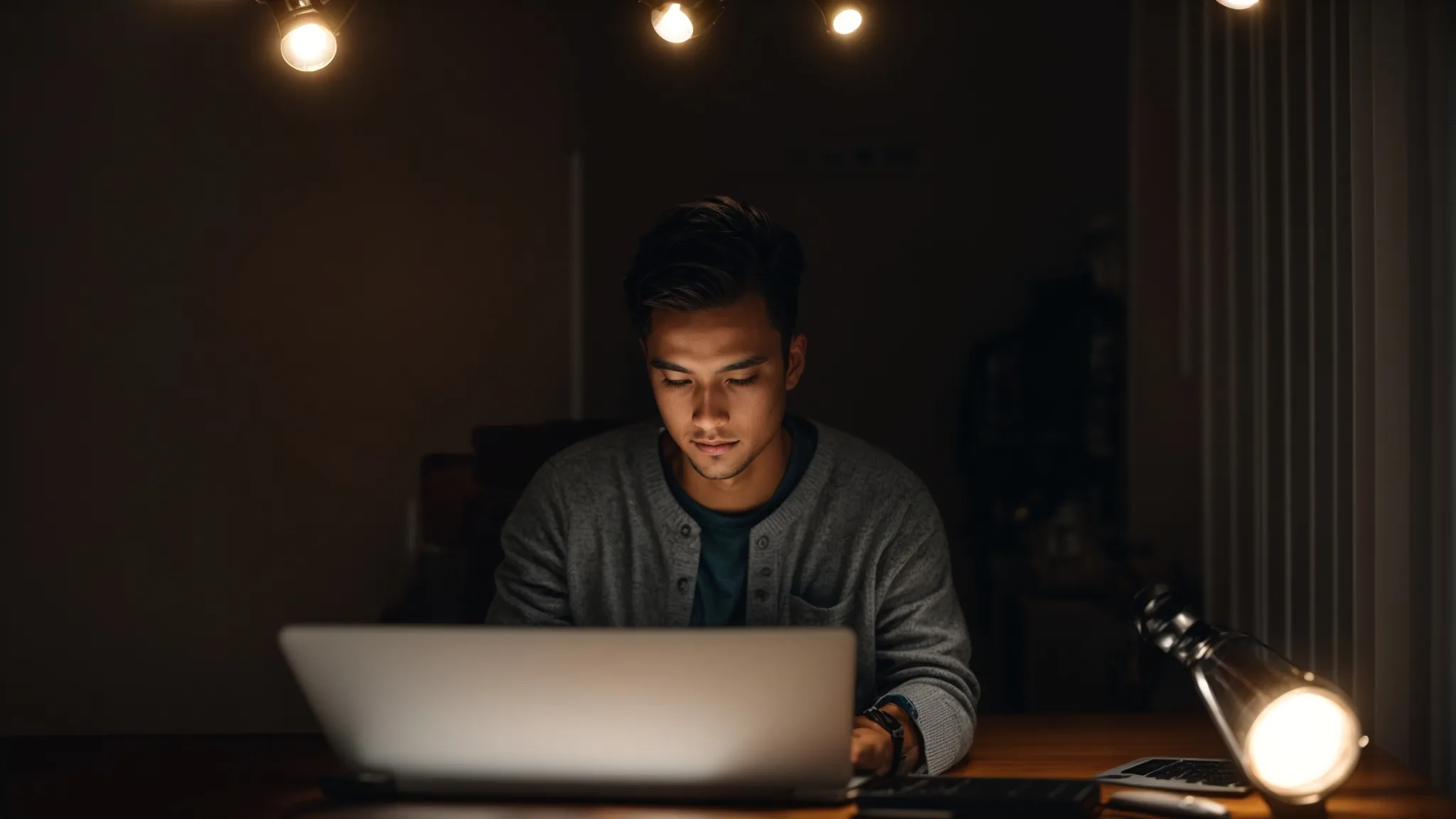 a person typing on a laptop with a light bulb glowing overhead to signify a bright idea.