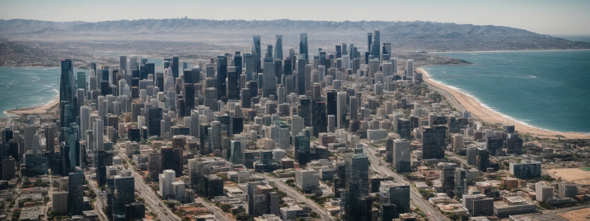 a panoramic view of the california skyline blending tech hub skyscrapers with the vast expanse of the pacific ocean.