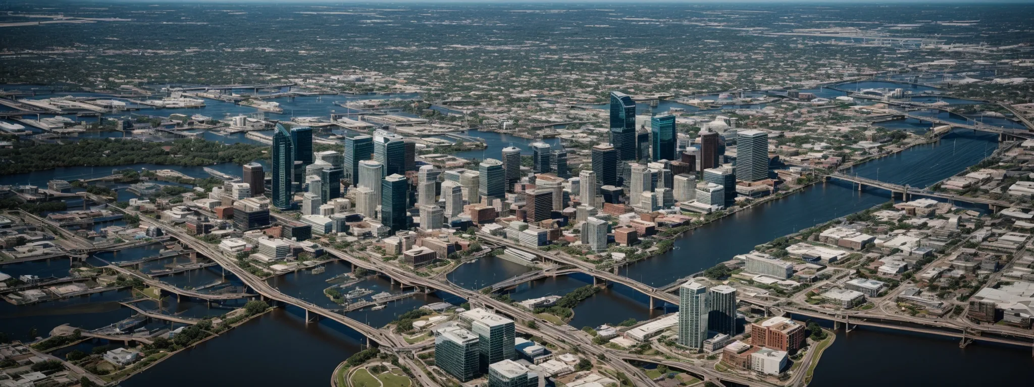 aerial view of jacksonville cityscape highlighting the bustling downtown area and meandering river.